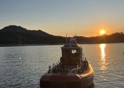Sunset on the lake with a fire boat.