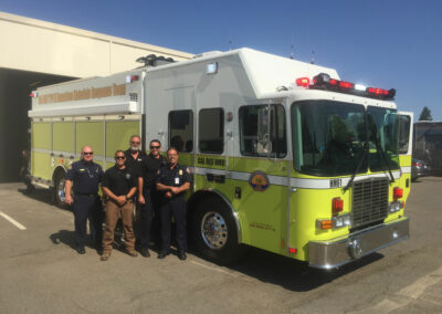 Group photo by hazmat vehicle